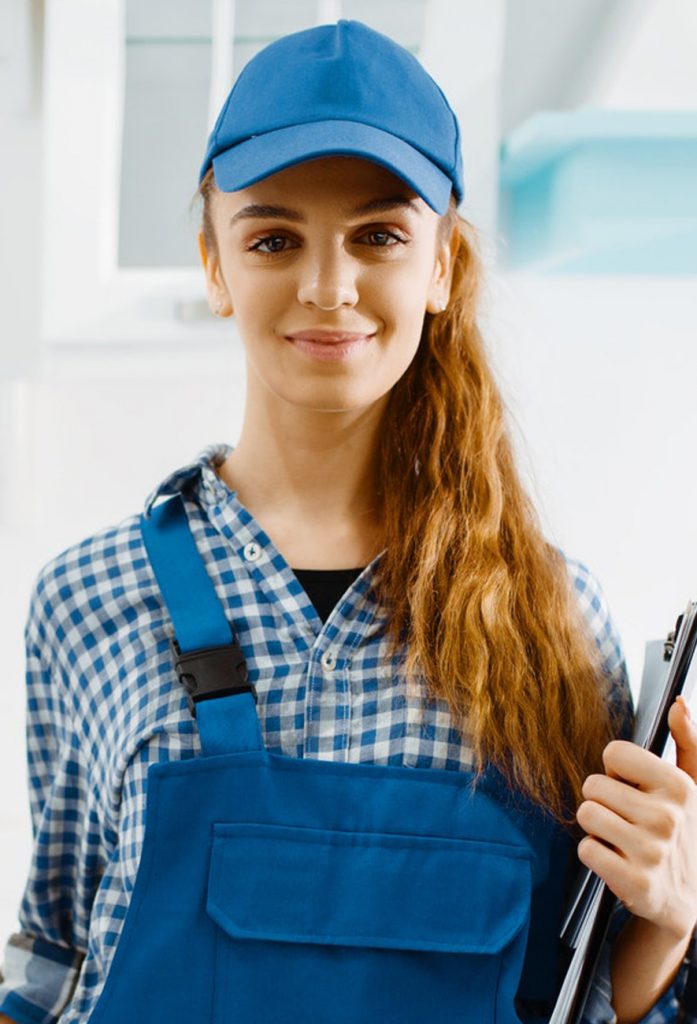 female furniture maker in uniform holds notebook