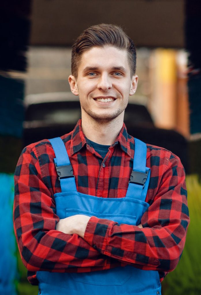 worker smiling on camera